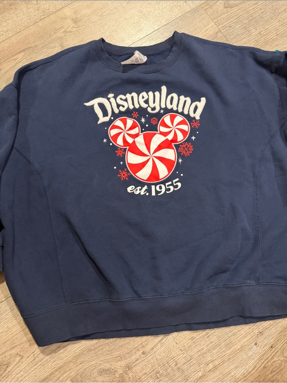 Disneyland Navy Blue Sweatshirt with Red & White Peppermint Graphic